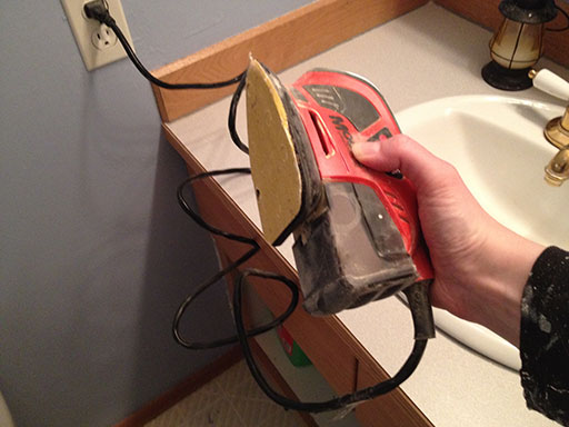 stain_bathroom_vanity_corner_sander